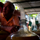 Estevez’s product is bottled and sold for consumption in homes and restaurants, with sales at an average of 50 bottles a day for 10 Cuban pesos (40 cents) apiece. (AP Photo/Ramon Espinosa)